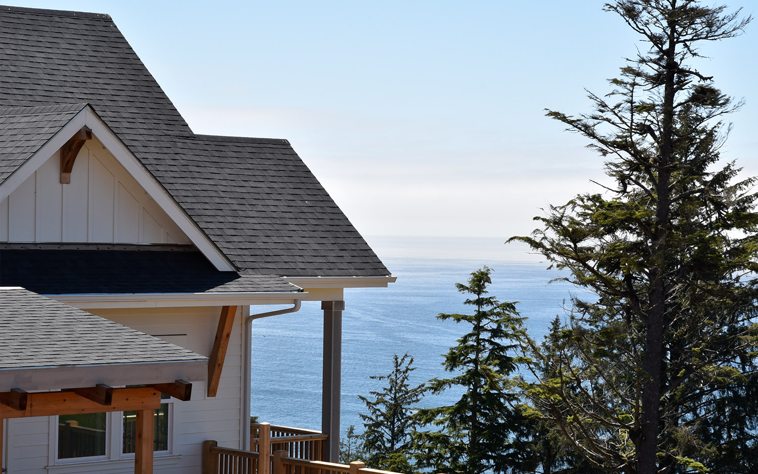 Modern home looking out at trees and mountains for a coastal home blog