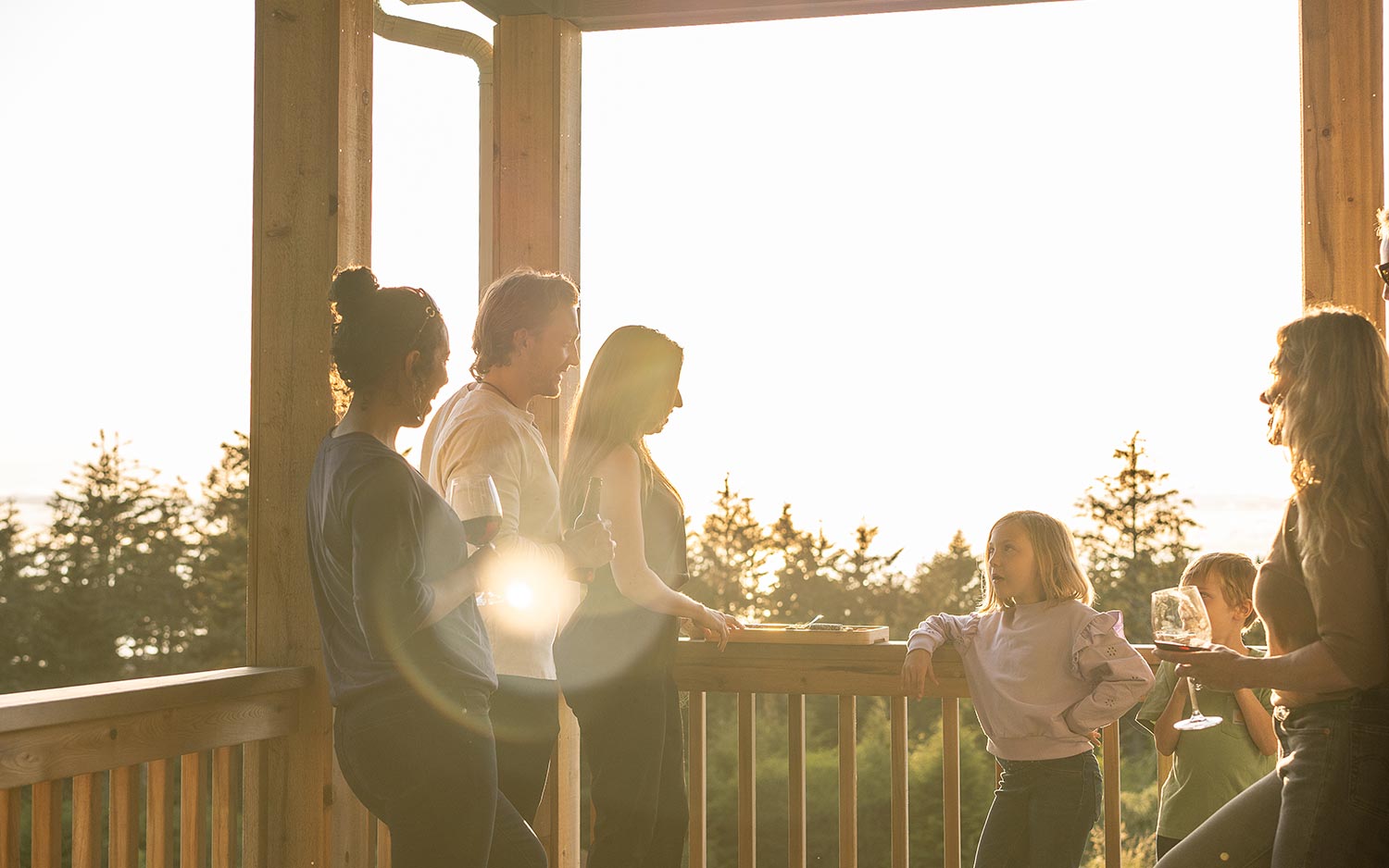 Family having conversation on balcony for a blog about Why Small-Town Living Appeals to Today’s Homebuyers